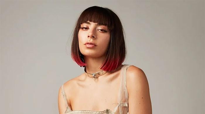 Charli XCX reflects on career start, work kept her from visiting father