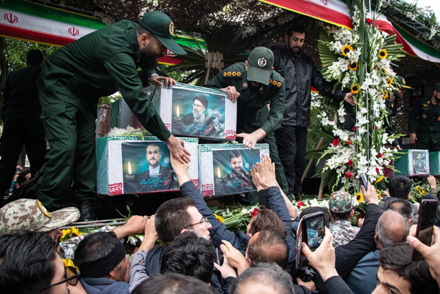 a picture of the late iranian president ebrahim raisi is seen on his coffin during a funeral ceremony held in tabriz east azerbaijan province iran may 21 photo reuters