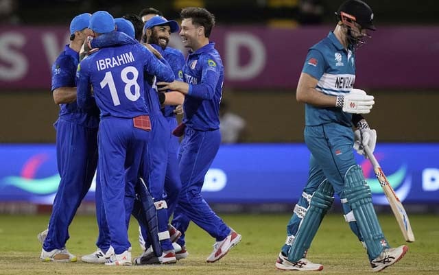 Afghanistan beat PNG to advance at T20 World Cup as NZ eliminated