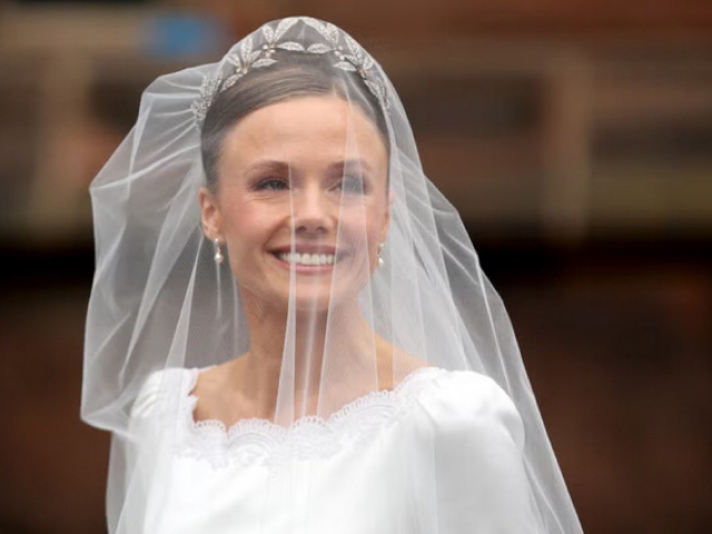 Bride vs. Dress: Watch Olivia Henson battle strong winds on her wedding day