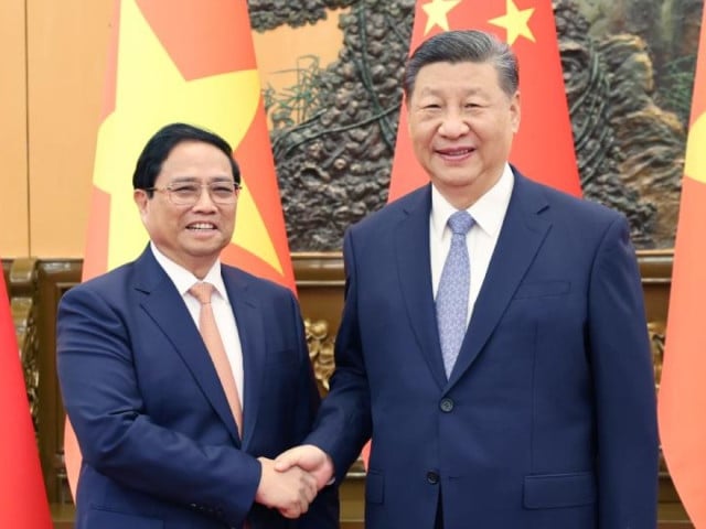 chinese president xi jinping meets with pm of vietnam pham minh chinh in beijing photo xinhua