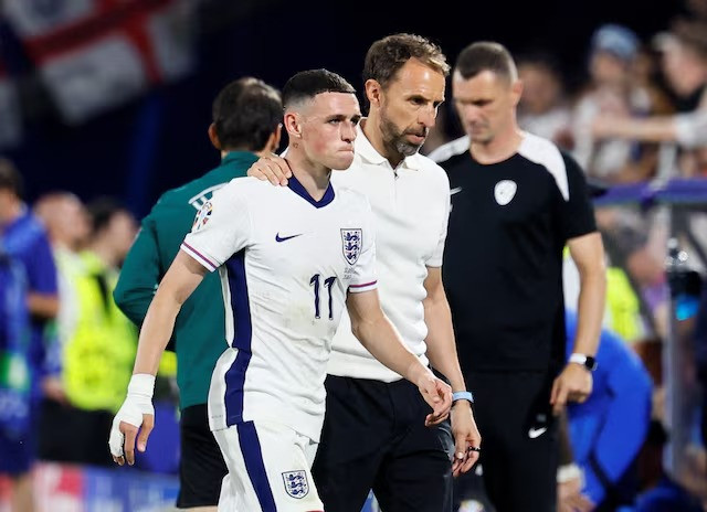 england s phil foden with manager gareth southgate after being substituted cologne stadium cologne germany june 25 2024 photo reuters