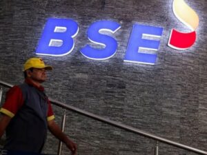 a man walks past the new logo of the bombay stock exchange bse building in mumbai photo reuters